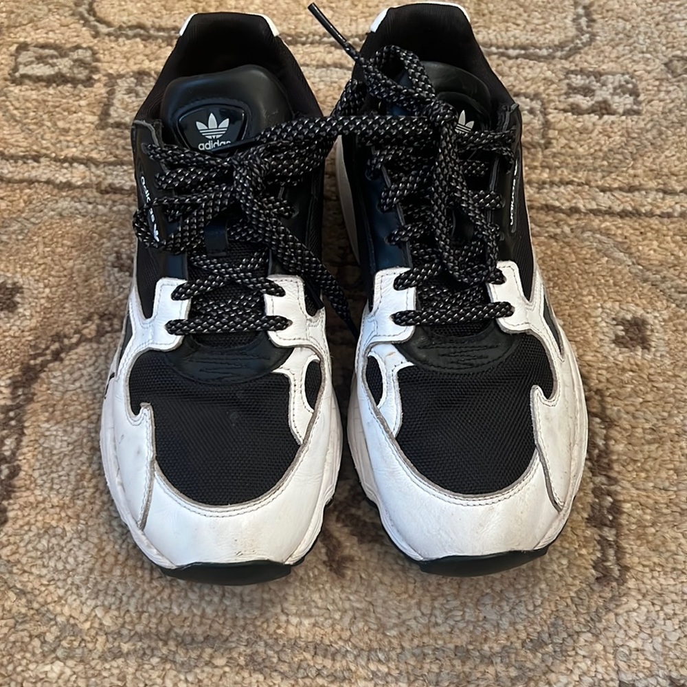 Black and white “dad” sneakers.